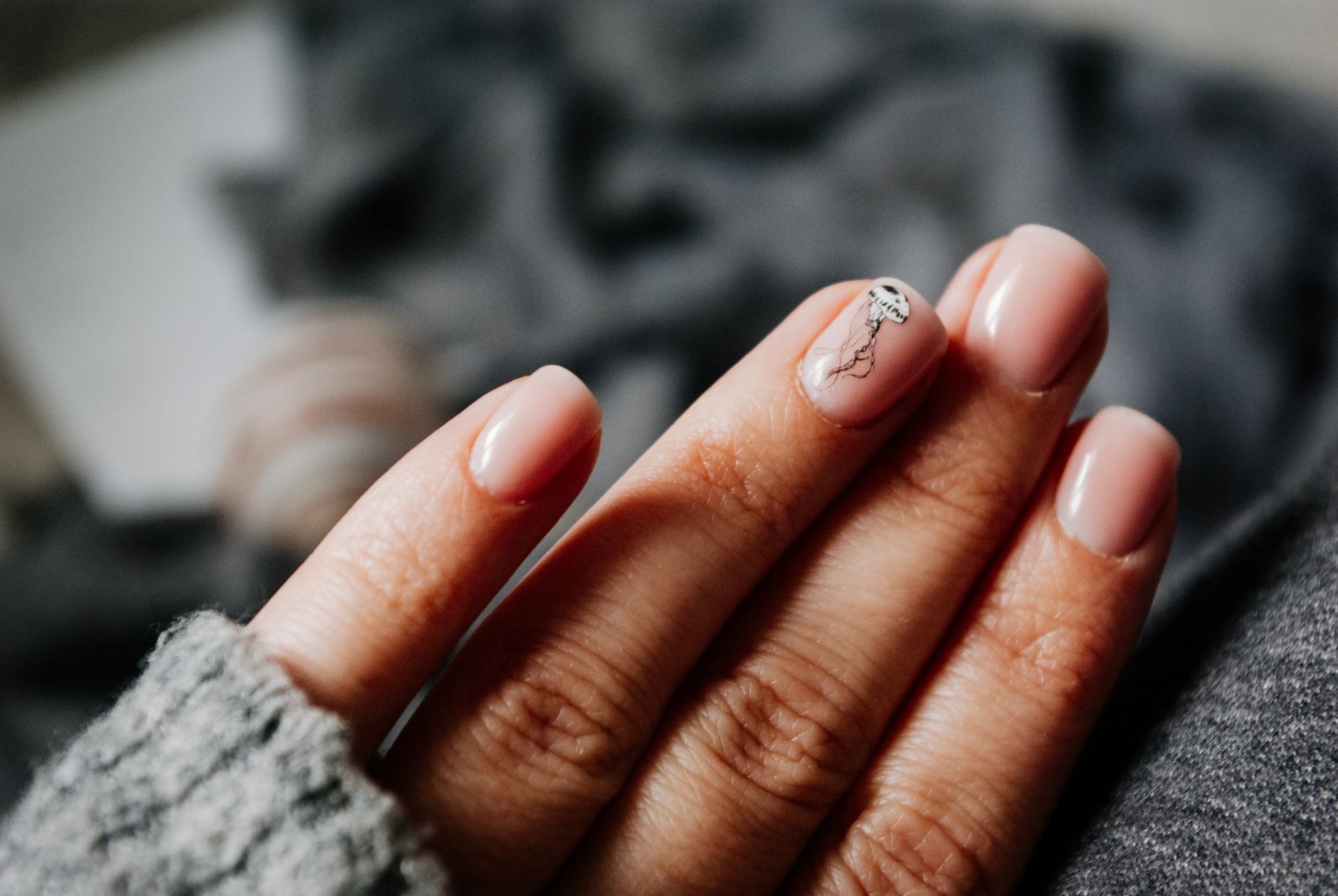 Close-up of natural nude manicured gel nails