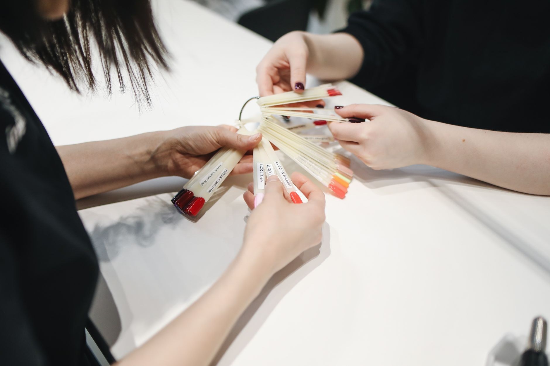 Client choosing a nail colour in the calm Hornby studio