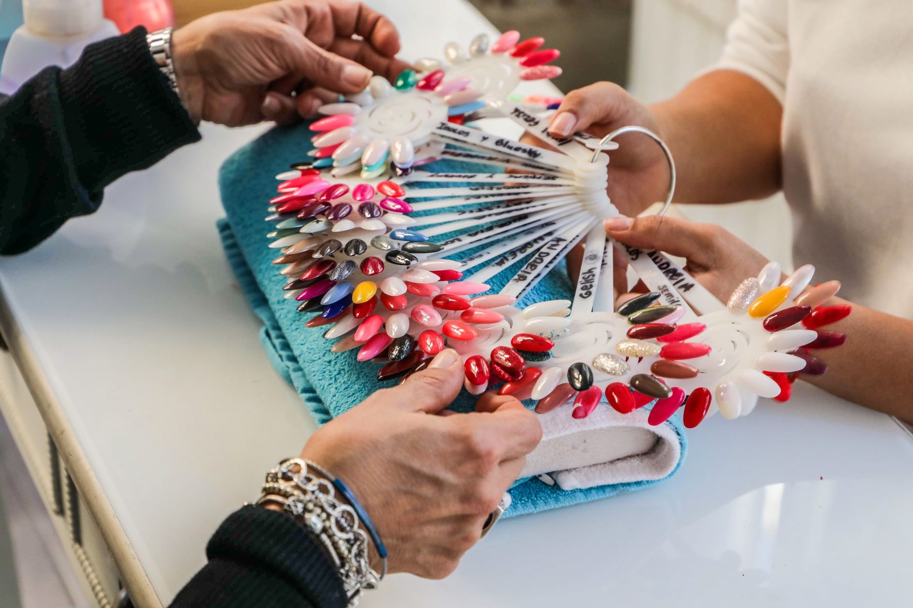 Colourful nail art sample tips on a display